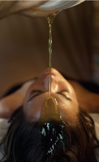 Shirodhara oil stream